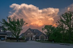 A sunset with clouds over a house in Flower Mound, Texas.