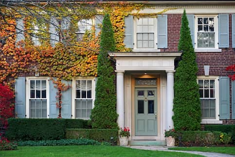https://www.quickenloans.com/learnassets/QuickenLoans.com/2022%20Images/Stock-Vine-Covered-Brick-Home-In-Fall-AdobeStock-125667682.jpeg