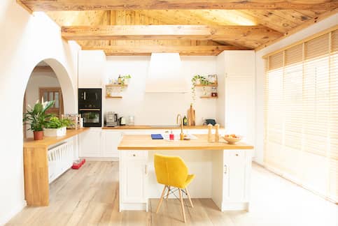 Bright kitchen with reclaimed wood ceiling. 