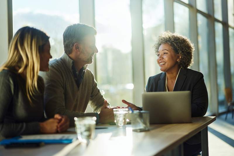 couple meets with a mortgage lender