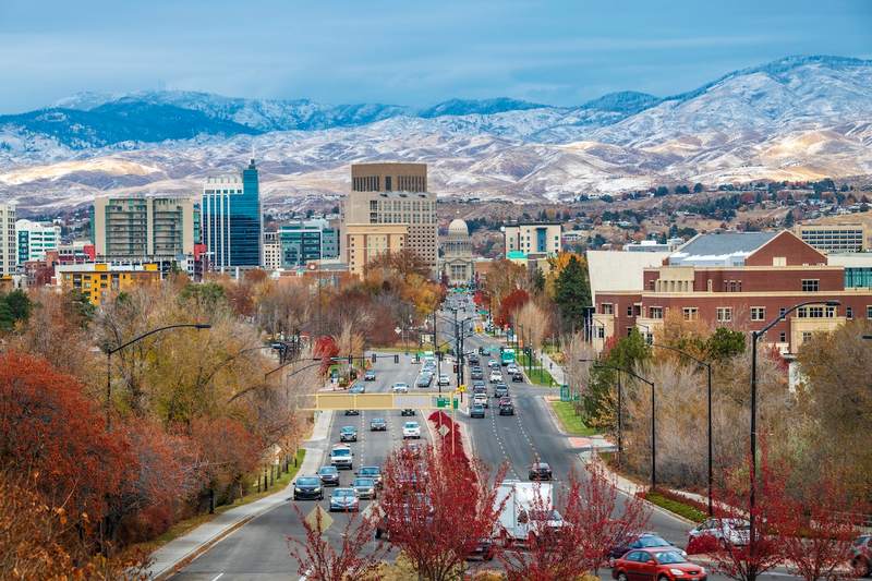 Boise skyline with snow-capped mountains in the distance.