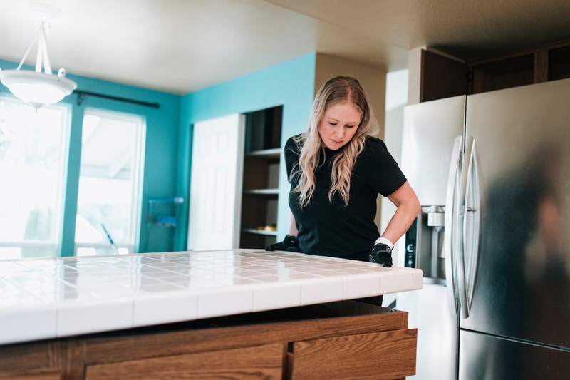 woman renovates kitchen